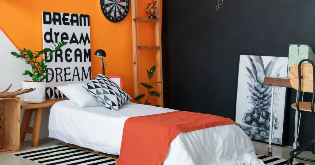 Black Bed with orange walls