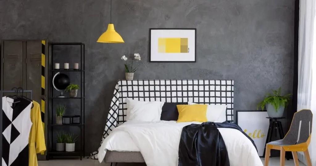 Black bedroom with a fun lamp