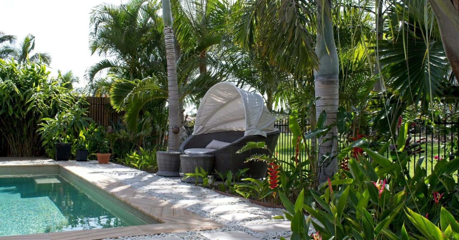 Create a backyard oasis with these tropical pool landscaping ideas