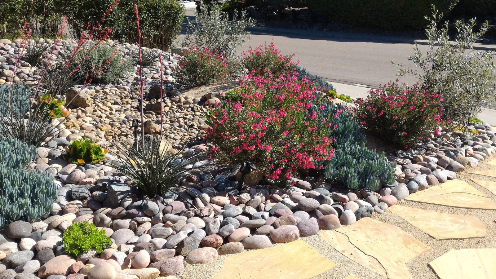 Use rocks and mulch to create stunning landscaping features in your yard